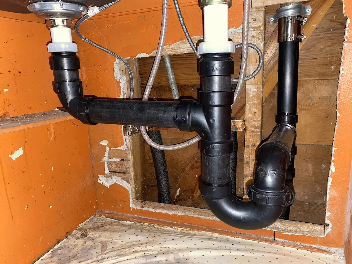 Professional Garbage Disposal Repair equipment and tools on the job in New Brighton